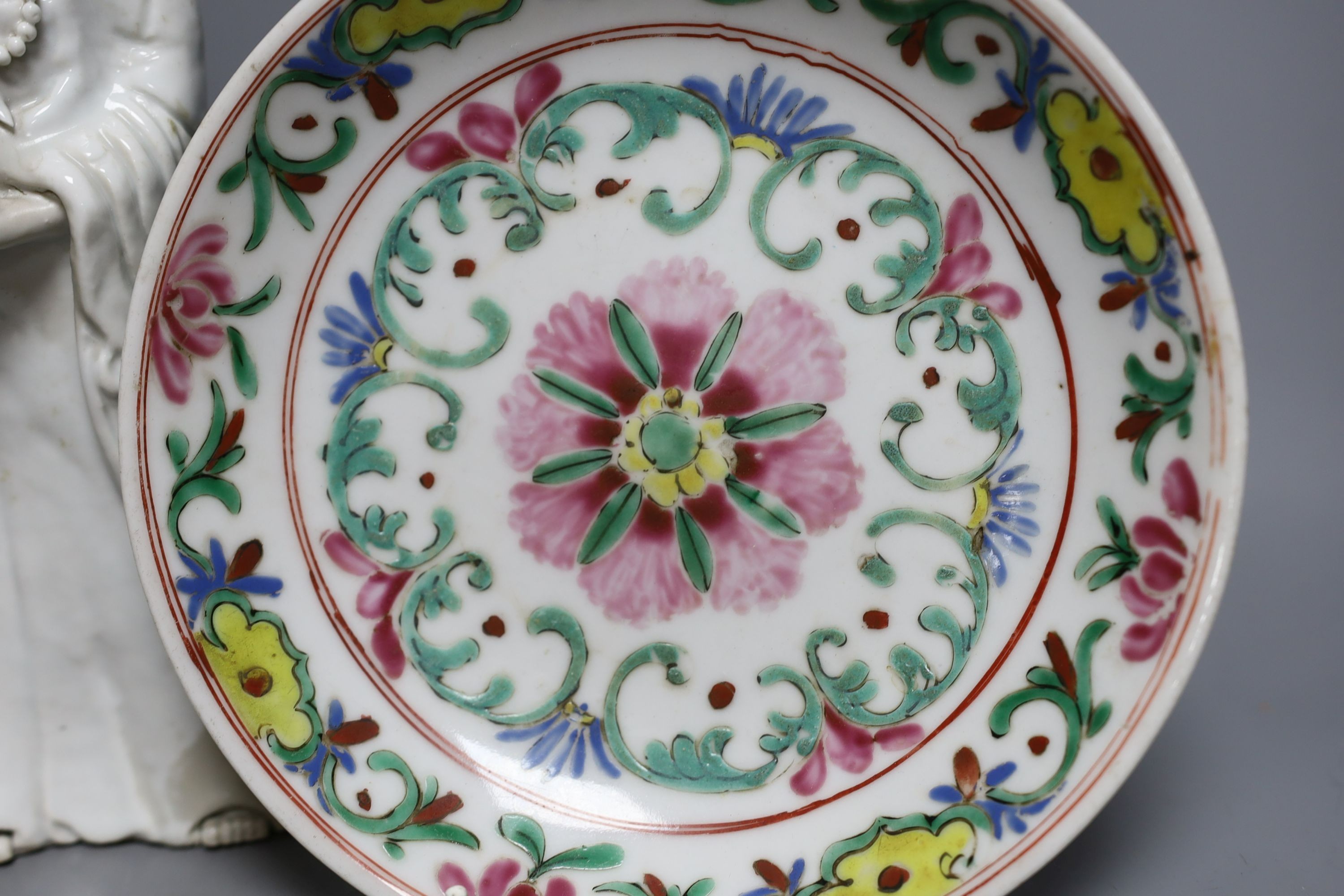 A Chinese blanc de chine figure of Guanyin, probably 18th century and two famille rose plates. Tallest 26cm